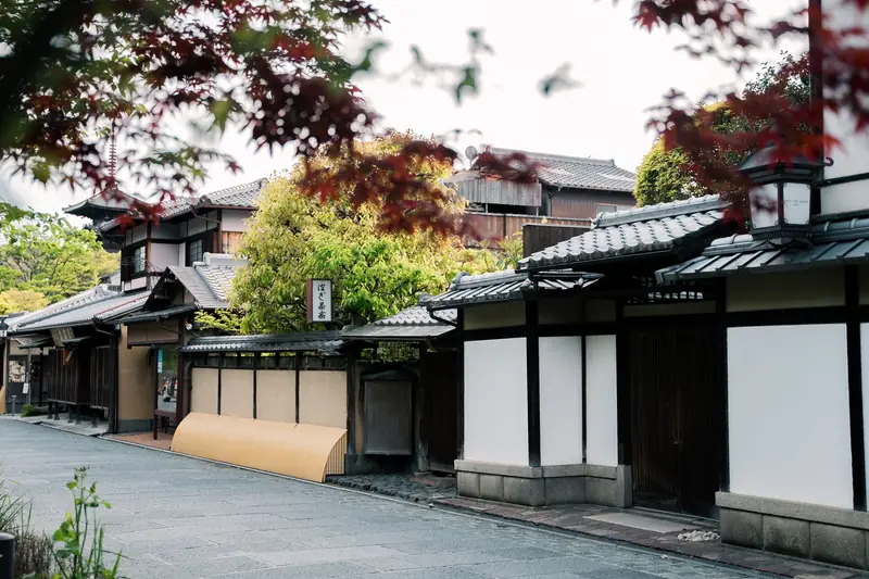 A quiet Kyoto street lined with traditional wooden houses
